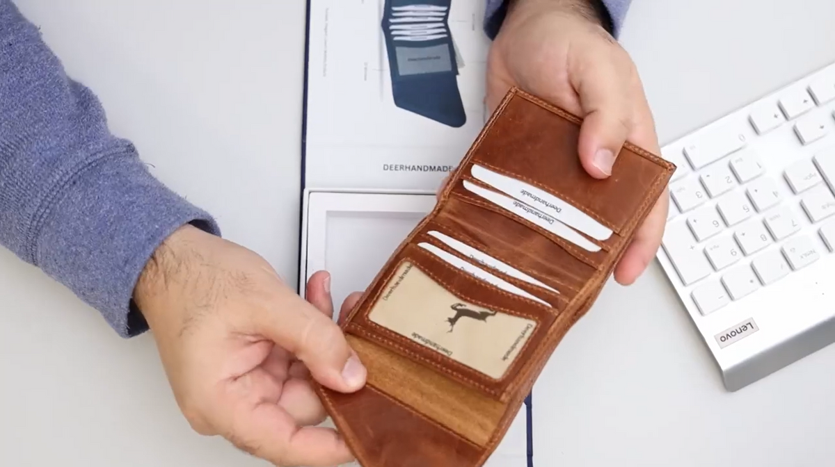 Load video: <p>Crafted from rich, full-grain calf-skin leather and finished with marine-grade polyester stitching, the Deerhandmade Slim Bifold is built to sit flat in your pocket without sacrificing what a wallet needs to hold. At just 4 x 3.5 x 0.3 inches and 3.13 oz, it folds once into a genuinely slim profile, with 6-9 card slots, a quick-access ID window, and a hidden cash pocket for bills, all secured by a magnetic snap closure and backed by RFID-blocking protection against unauthorized scans. Like all full-grain leather, it's designed to develop a unique patina the longer you carry it, arrives gift-boxed, and is backed by a lifetime warranty.</p>